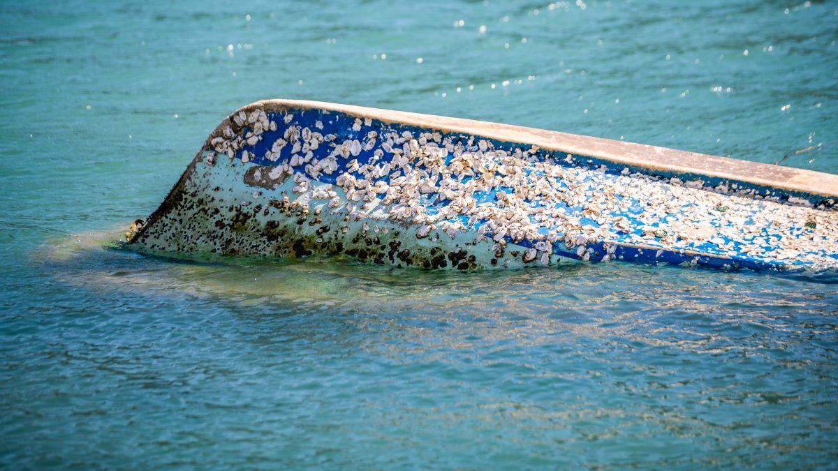 overturned boat in water