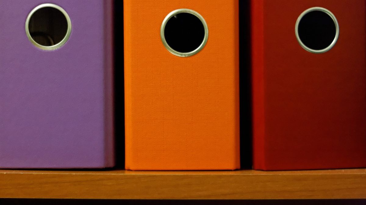 colorful filing binders on shelf