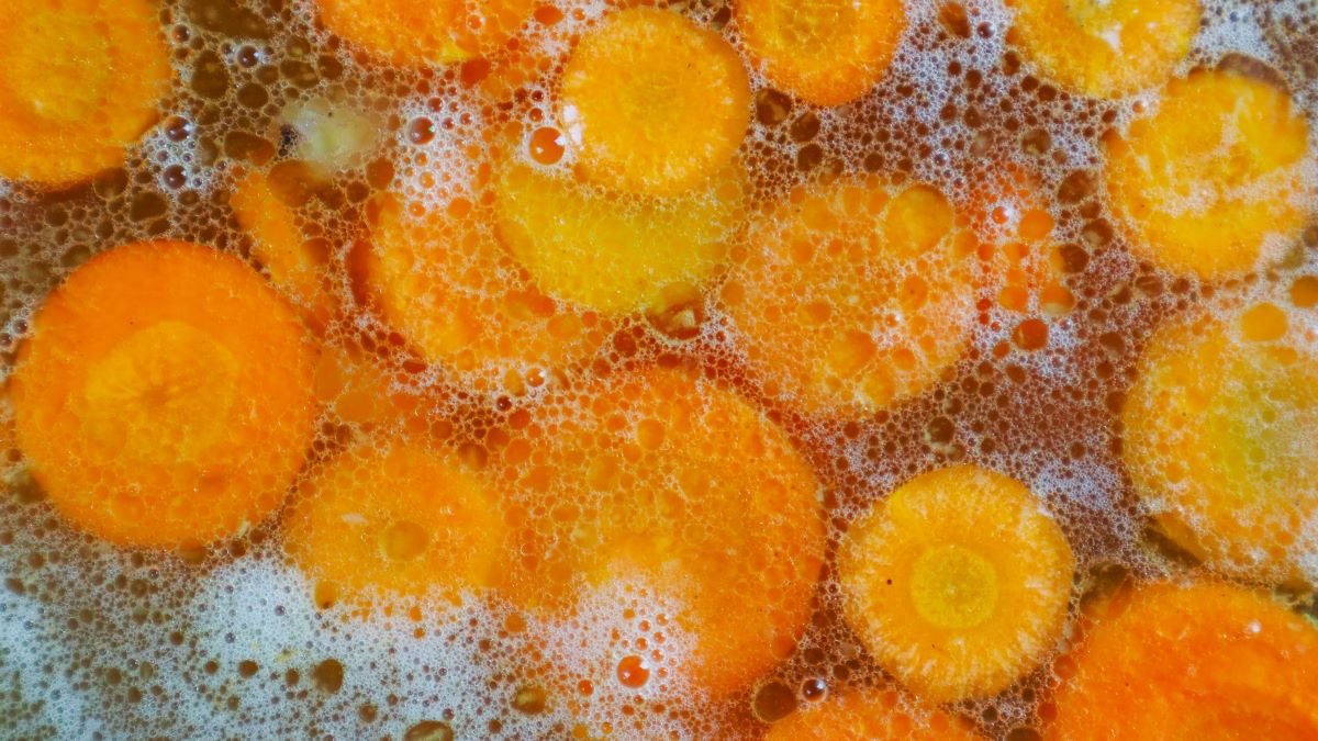 simmering carrots on stovetop