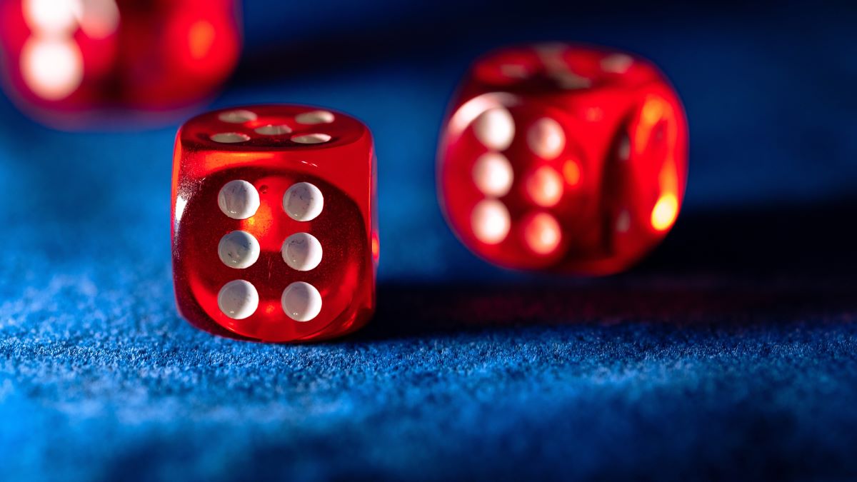 red dice on blue table