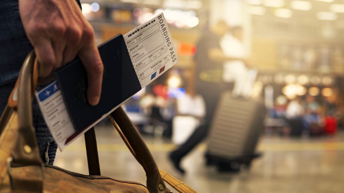 person with boarding pass in airport